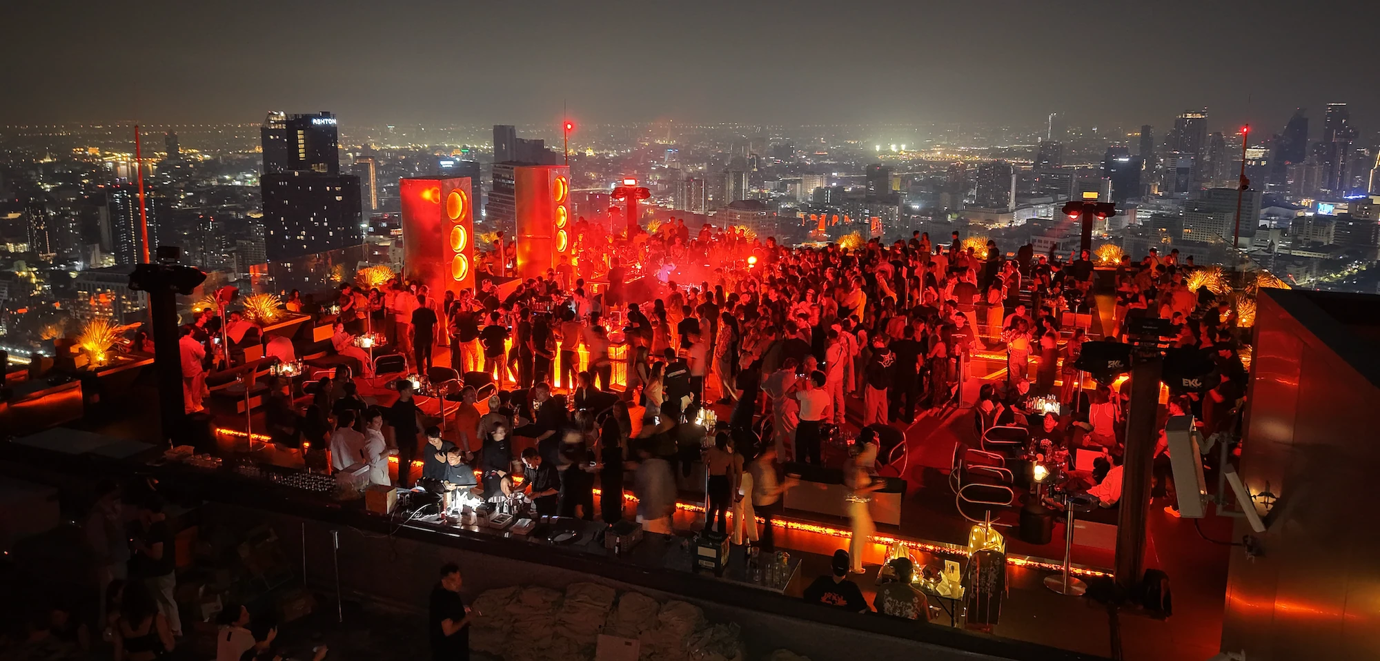 Bangkok rooftop terrace set for a private group event at sunset