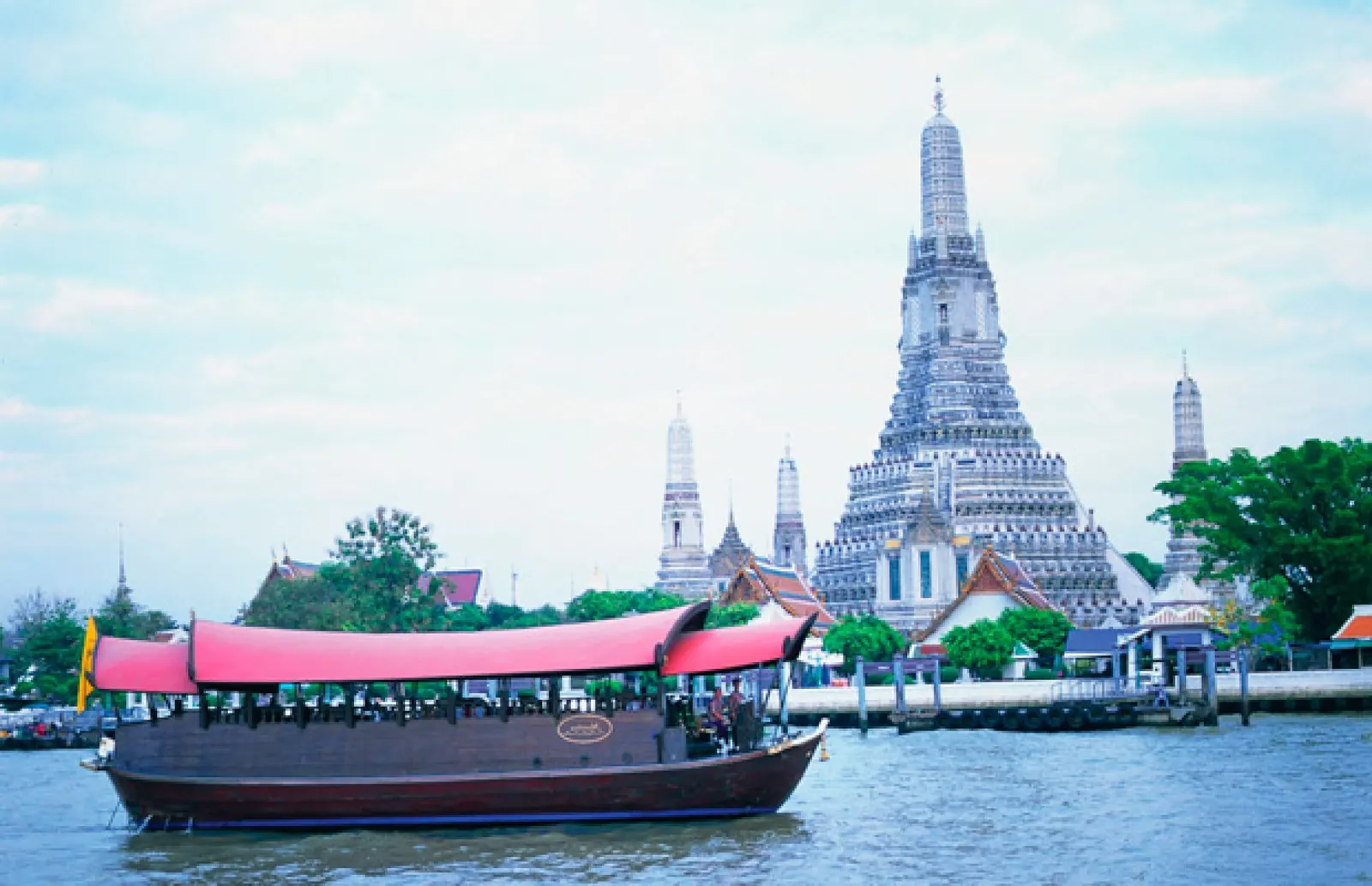 The Manohra barge on the river in front of Wat Arun