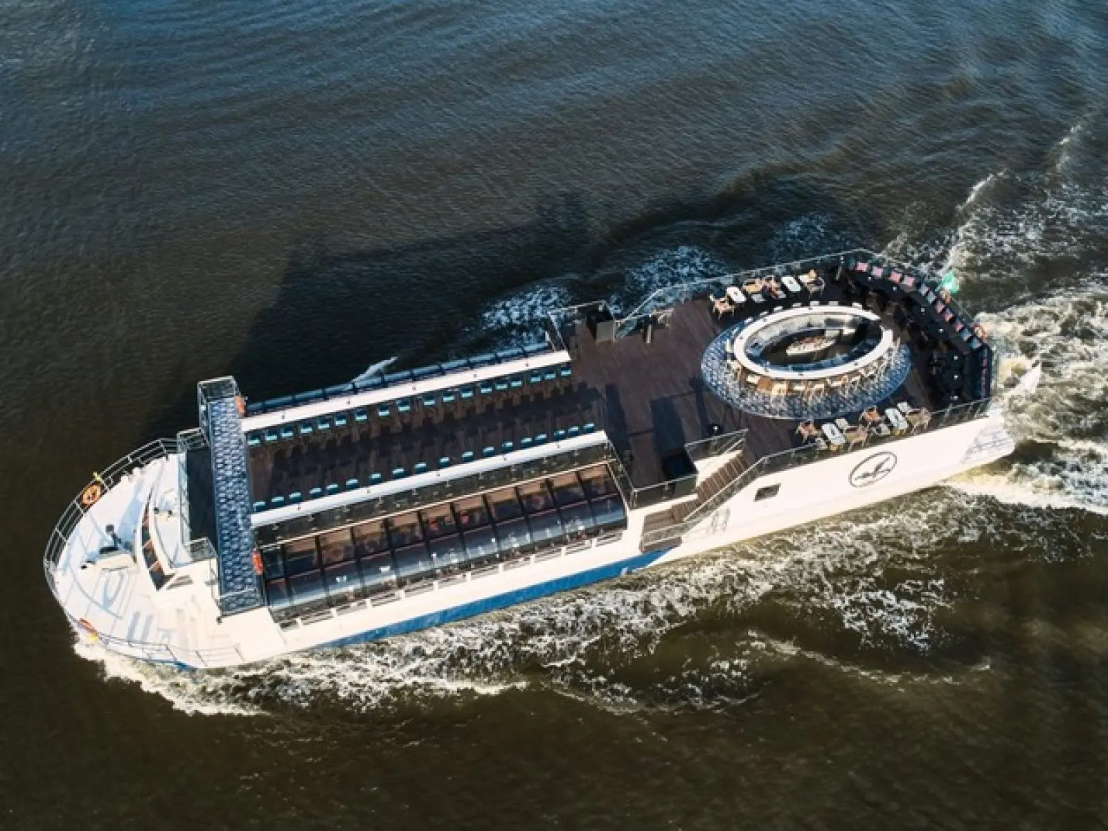 The Saffron Cruise from above, showing its glass-roofed dining deck and open rooftop
