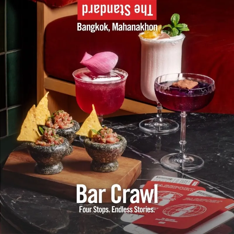The Standard Bar Crawl poster, with tuna tartare bites, three drinks and red passports on a marble table