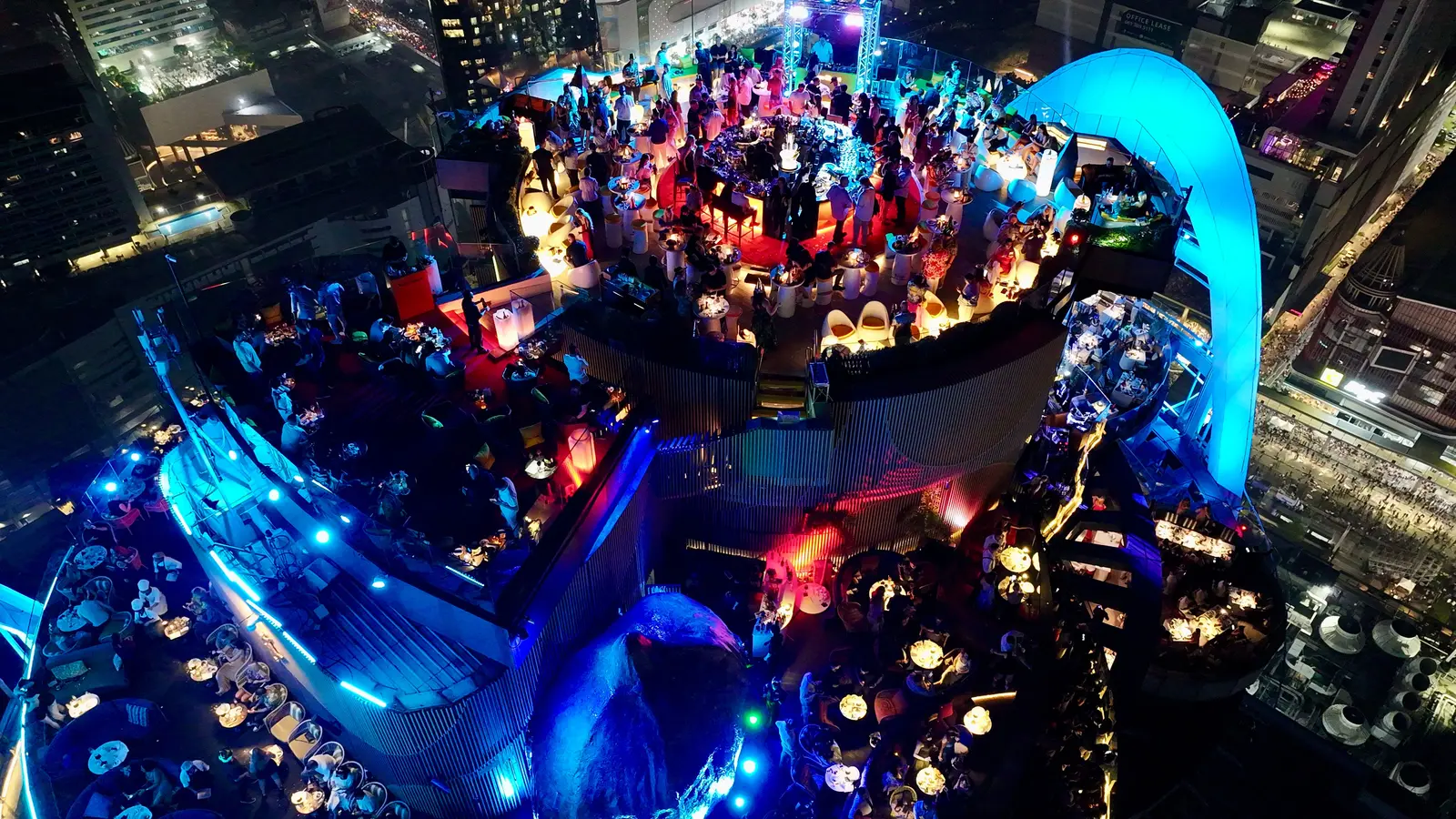 Night view of Red Sky bar and restaurant's curved deck on the Centara Grand tower at CentralWorld, Bangkok