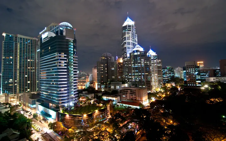 The Athenee Hotel among the Wireless Road towers at night