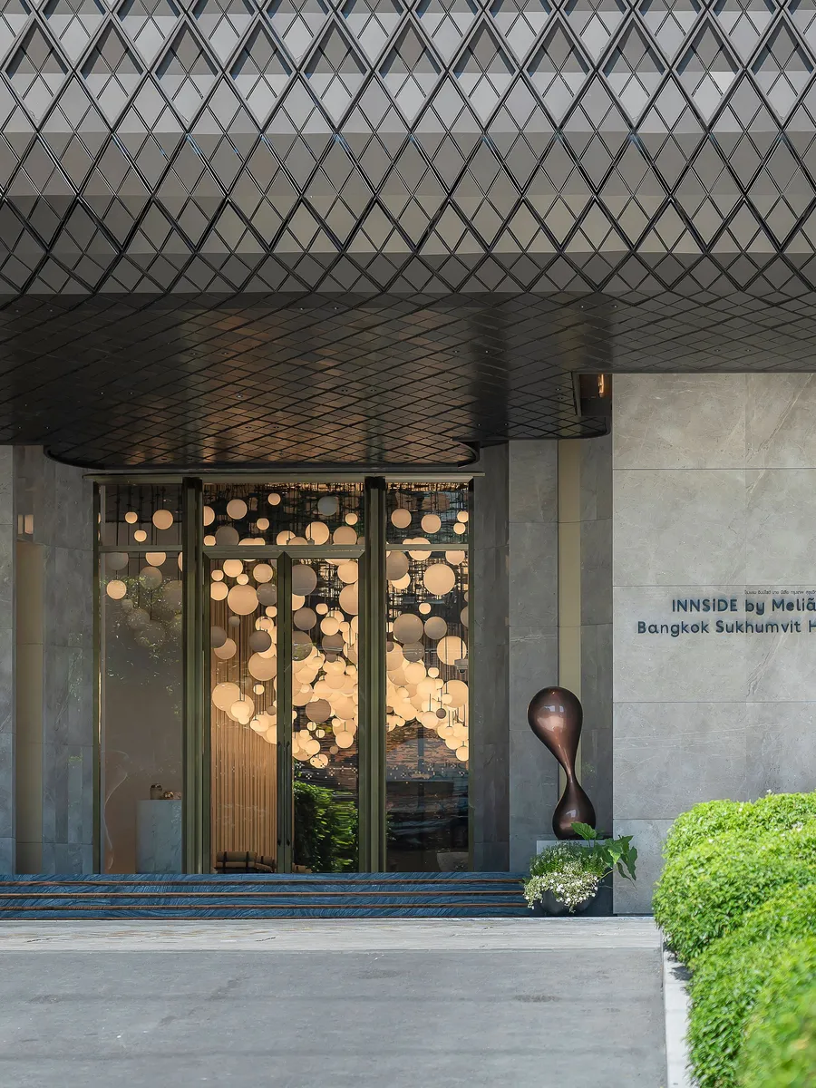 The entrance of INNSiDE by Meliá Bangkok Sukhumvit on Sukhumvit Road by day