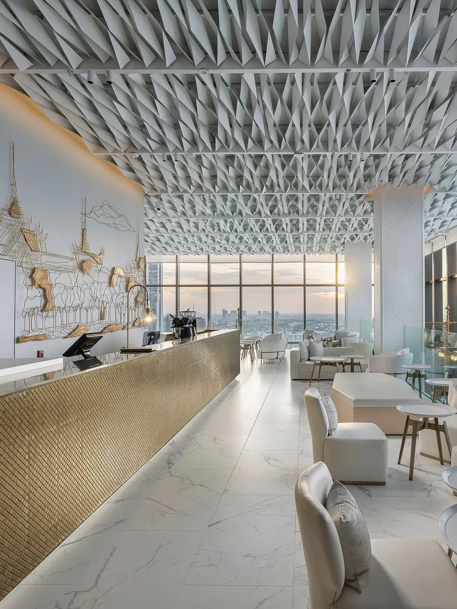 The Open Living Lobby at INNSiDE by Meliá Bangkok Sukhumvit, a long counter and lounge seating by the windows