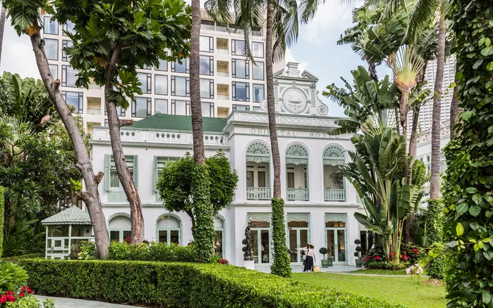 The Authors' Wing of the Mandarin Oriental, Bangkok in its garden, with the River Wing tower behind