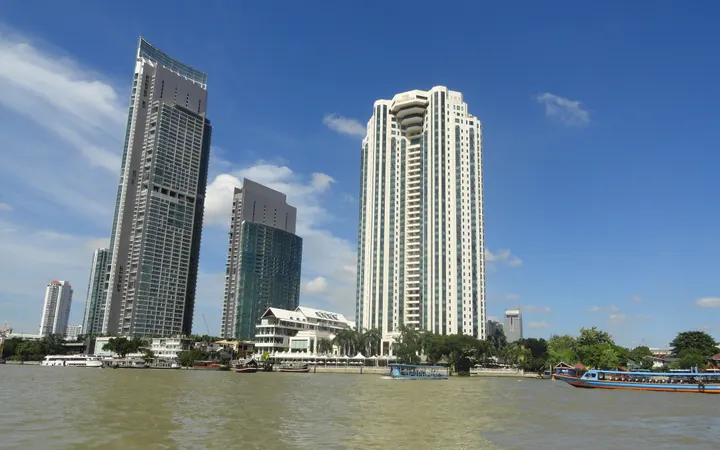 The Peninsula Bangkok tower on the Chao Phraya, seen from the river
