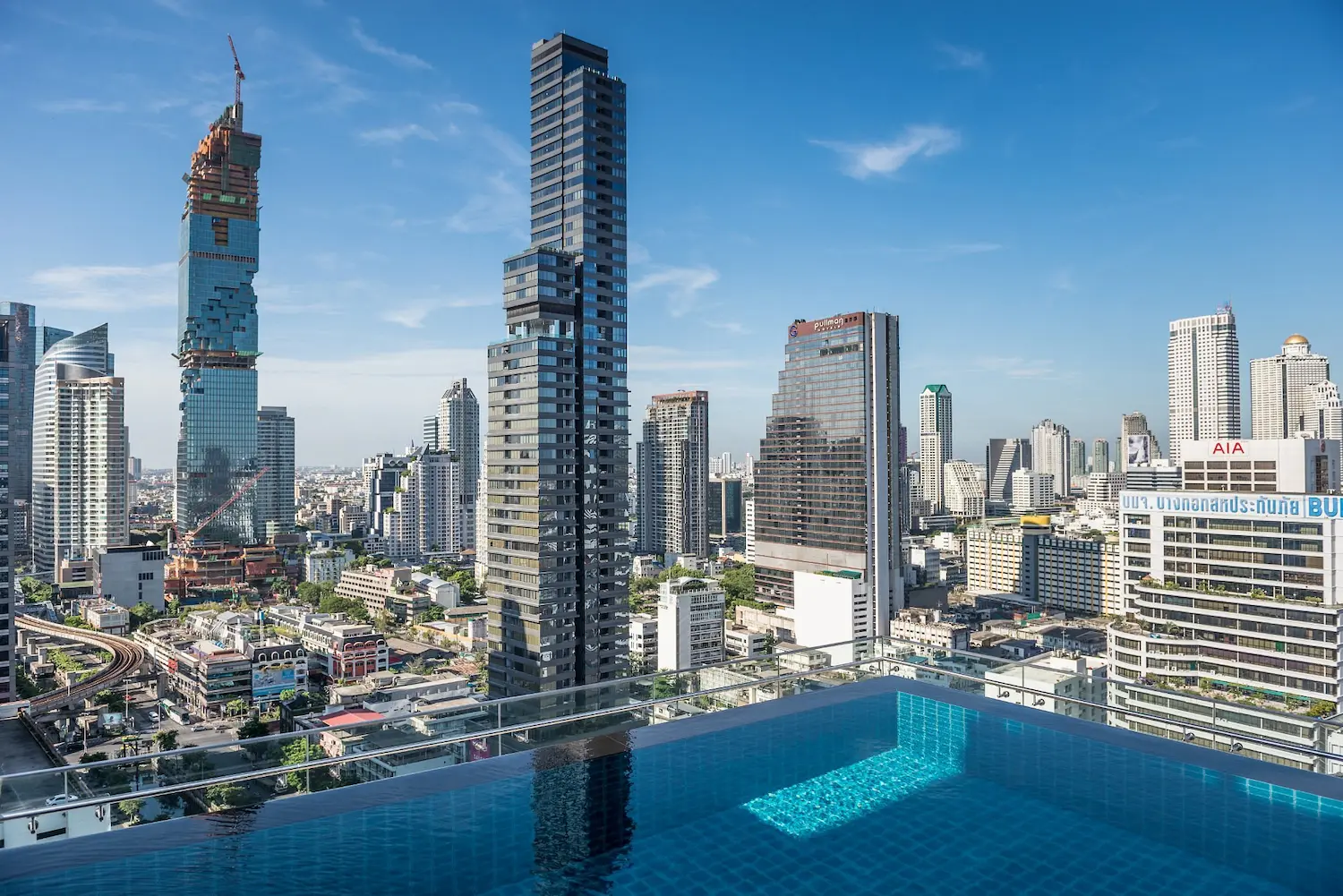 The Bangkok skyline seen from the AkaAza rooftop pool deck at the Amara Bangkok Hotel