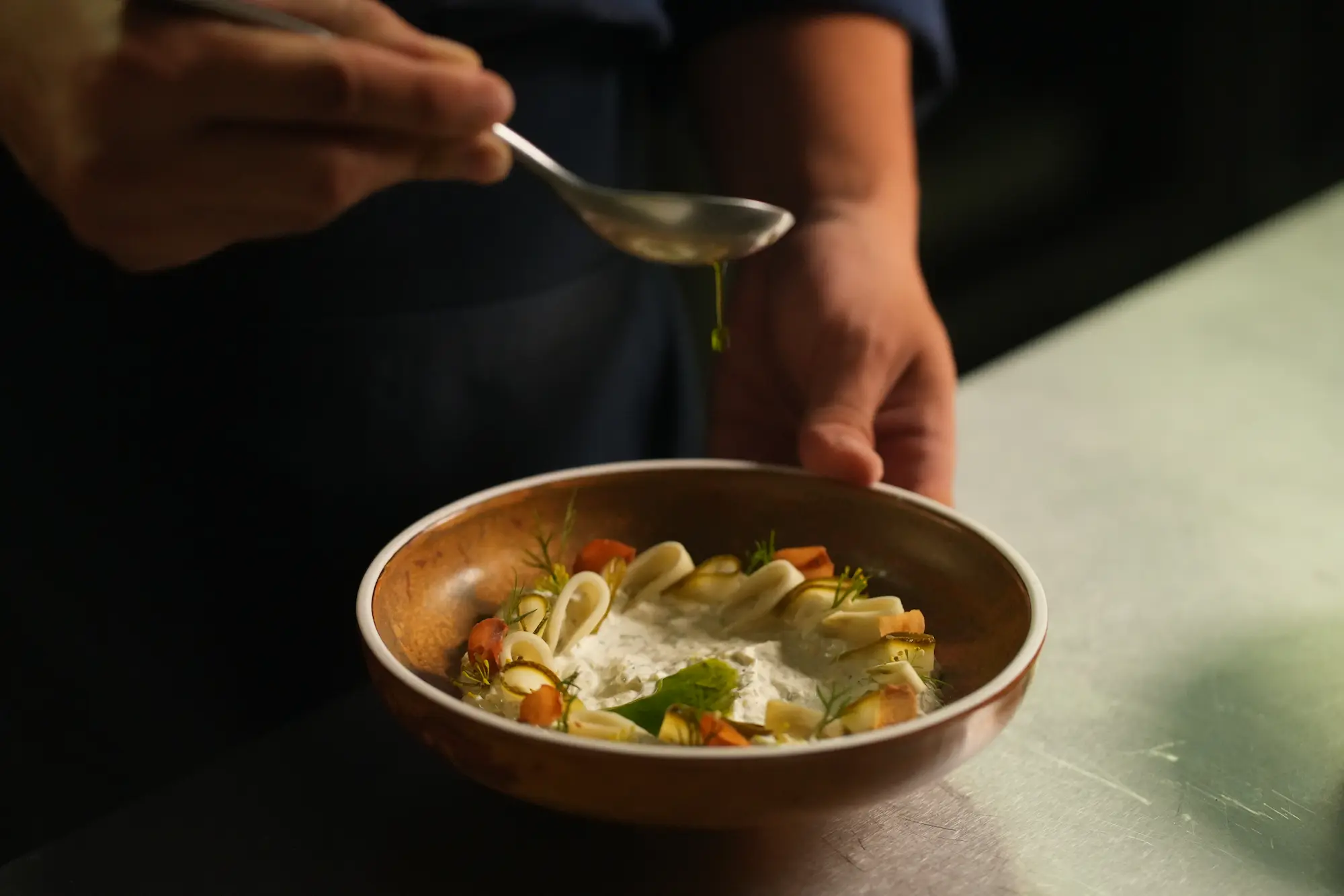 A plated Mediterranean dish garnished and ready to serve at View rooftop, Bangkok